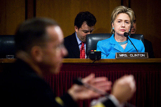 Hilary Clinton at a Defense meeting, looking serious