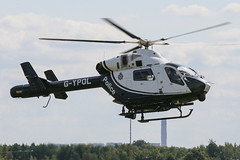 G-YPOL - 2000 build MD Helicopter MD900, grass flying everywhere as the Helicopter manoeuvres