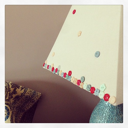 Customising the lampshades with buttons. I think I like.