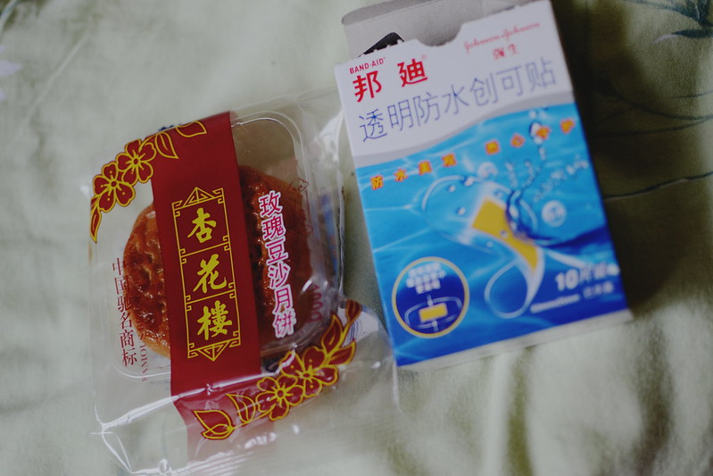 One of the first buys - mooncake with rose-bean paste and bandaids