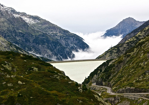 Foggy Grimselsee surrounded by mountains