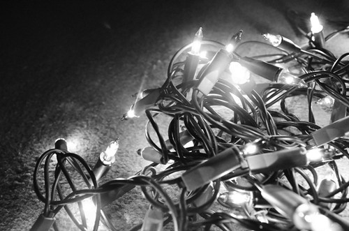 Coloured fairy lights in black and white by PhotoPuddle
