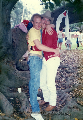 P018.011m.r.t San Diego Pride Parade 1988: Two men hugging in the park