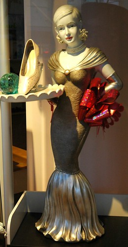 Shoe salesgirl statue, shoe, glass, red bow, San Mateo, California, USA by Wonderlane