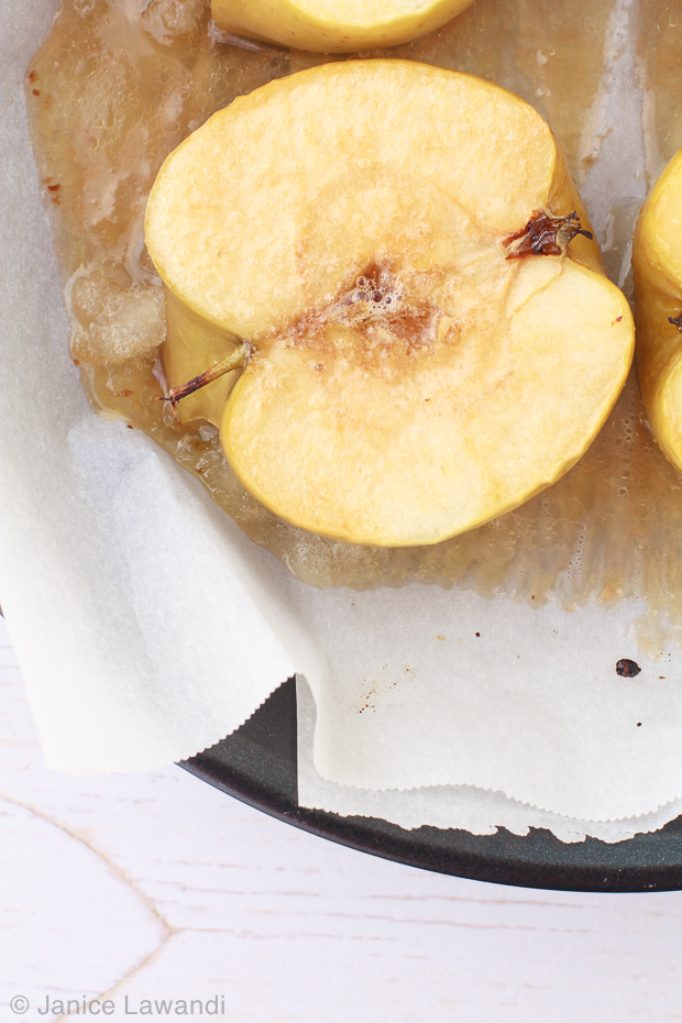 Baked apples on parchment paper.