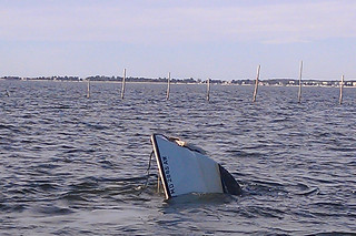 The bow of the 22-foot boat that capsized and sank with two men aboard approximately 200 yards off St. George Island, Md., Friday Dec. 13, 2013. A Coast Guard crew aboard a 25-foot Response Boat Small from Coast Guard Station St. Inigoes Md., diverted to the scene and rescued the two men. U.S. Coast Guard photo by Petty Officer 3rd Class Charles Murray