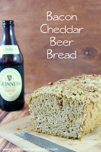 Bacon Cheddar Beer Bread loaf with a bottle of Guinness.