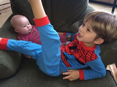 Leighton cuddles with Baby Evie by Guzilla