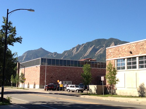 The Rockies looming behind a building, Boulder, Colorado
