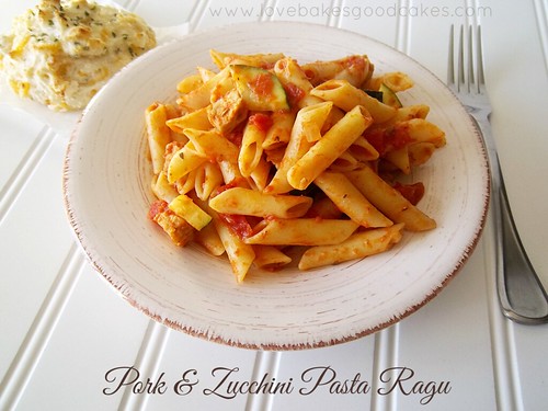 Pork & Zucchini Pasta Ragu in bowl with fork and {Copycat} Red Lobster Cheddar Bay Biscuit.