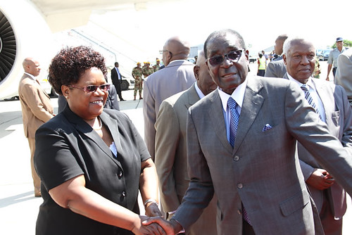 President Robert Mugabe says farewell to Vice-President Joice Mujuru enroute to Ethiopia for the special African Union summit on the International Criminal Court. The gathering is from October 12-13, 2013. by Pan-African News Wire File Photos