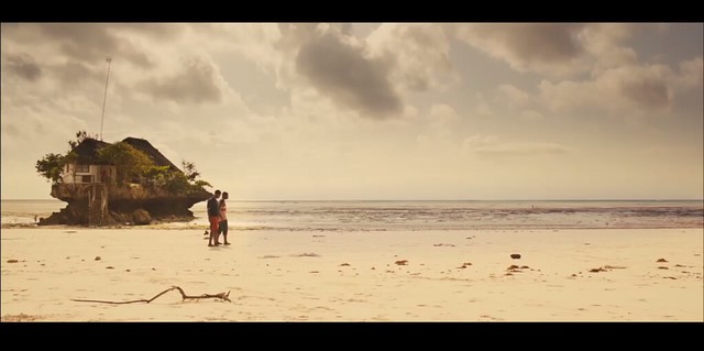 A still from Jonah of two guys walking on the beach
