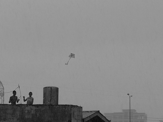 Flying kite in the rain. Photographed by Bernard Eirrol Tugade
