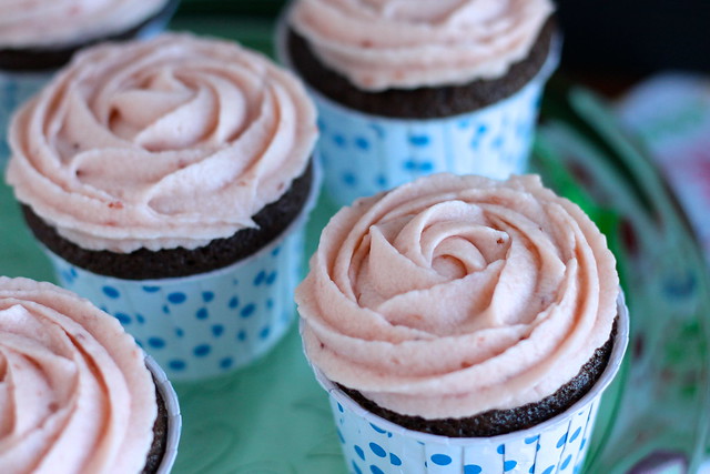 Chocolate cupcakes and strawberry rosettes