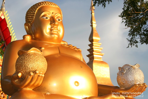 Happy Buddha along the Mekong river in temple Wat Luang Phon Phisai by tGenteneeRke along the Mekong river