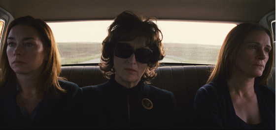 the three stars of August Osage County looking despondent in a car