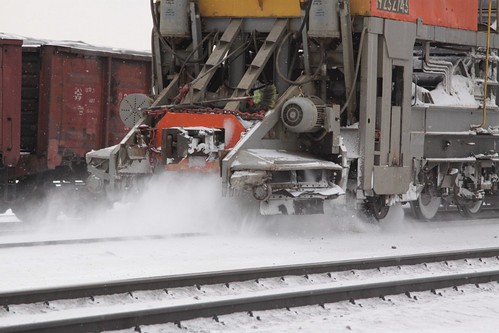 Detail of the collection head removing snow from the tracks
