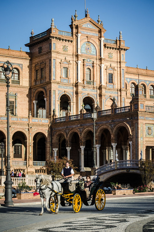 Hire a horse drawn carriage in historic Sevilla, Plaza de España is the final stop.