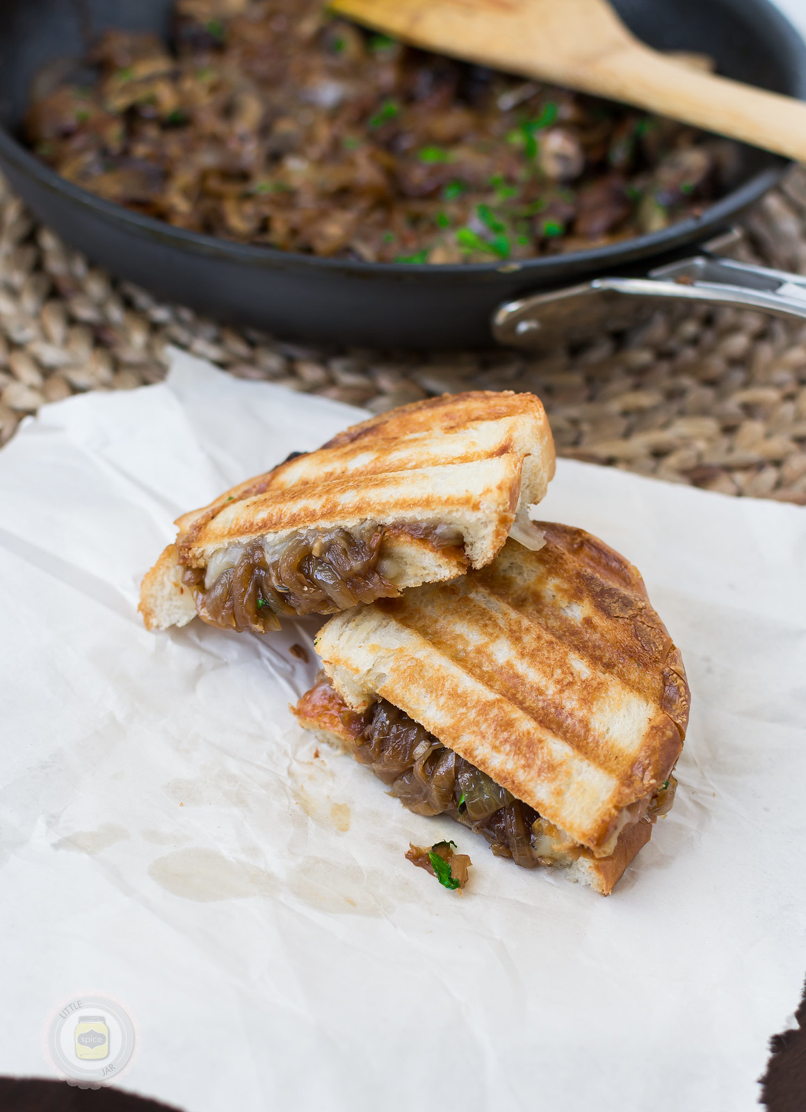 Caramelized Onion and Baby Bella Panini Melt on paper