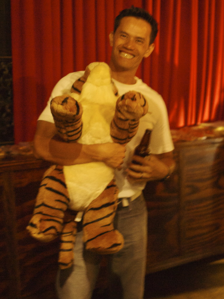 man with stuffed tiger