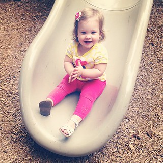 She claps for herself every time she goes down the slide.