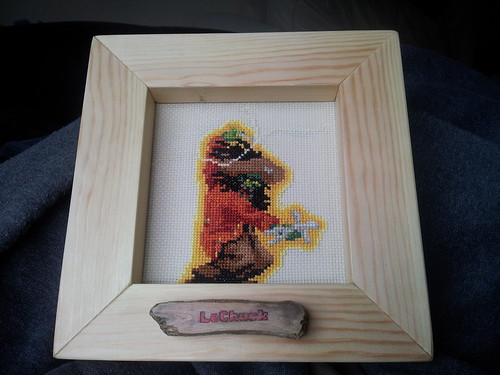 Nearly finished LeChuck cross-stitch + frame, button and electronics