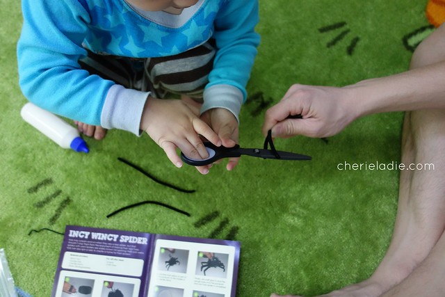 Pipe cleaners for spider legs in craft activity 