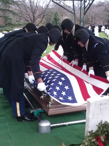 An American flag is draped over Lt. Col. Roger Waldens casket at Arlington National Ceremony. (Stefani Walden)
