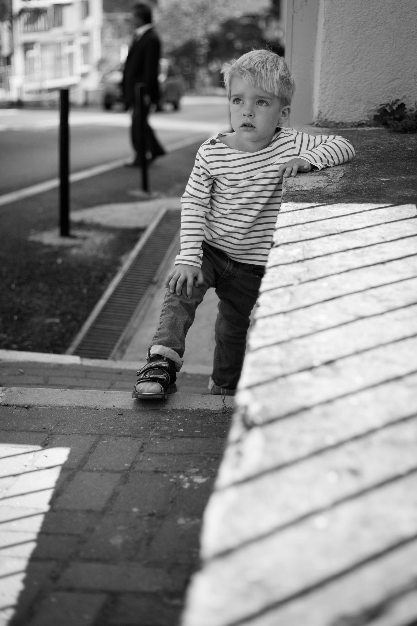 Dragging his feet to kindergarten.