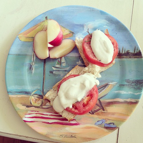 Beach house lunch: toasted Italian bread w. tomato, rosemary and cashew spread w. a sliced nectarine. #vegan