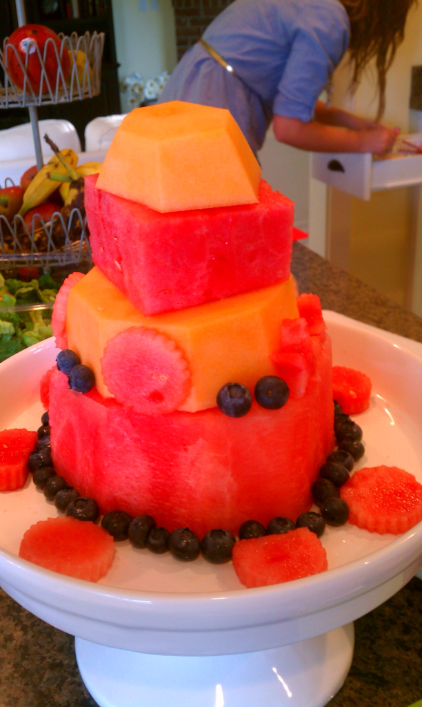 Layering watermelon and cantaloupe for birthday cake