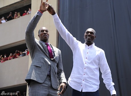 July 13, 2013 - Dwight Howard and Hakeem Olajuwon raise their hands to the crowd outside Toyota Center at Howard's welcome rally