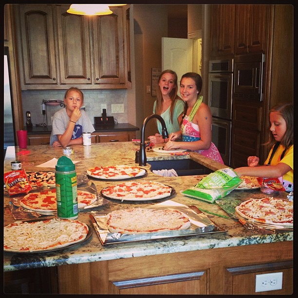 My helpers. We cranked out 8 homemade pizzas today!  Yummy!  Thanks
