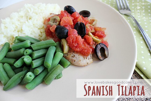 Spanish Tilapia with white rice and green beans on plate.