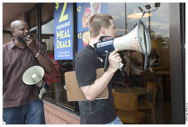 Dustin Ponder and Calvin Johnson-organizers-walk out of Wendy's with bullhorns