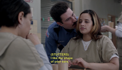 The guard from OITNB whispers to an inmate that he likes her ears
