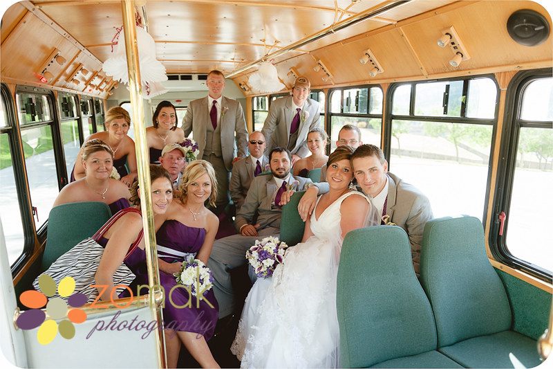 Wedding party rides the trolley from their cathedral wedding to reception location in helena
