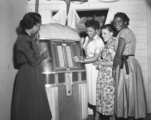 Women at the jukebox during a New Year's Eve party in Tallahassee, Florida