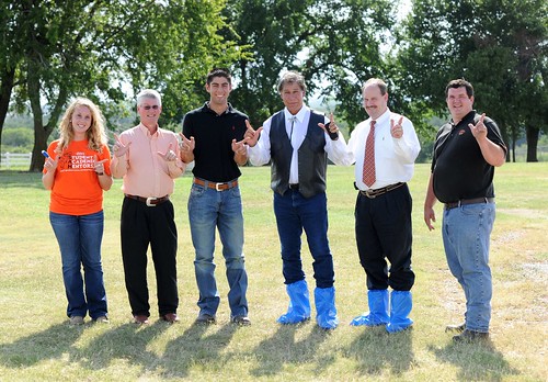 “Go Pokes!” At Oklahoma State University, Under Secretary Edward Avalos visits with professors Clint Rusk (second from right) and Scott Carter (second from left), as well as John Staude, assistant herd manager, at an OSU swine confinement facility featuring modern waste and odor management technologies. The facility employs and houses 2-4 Animal Science students (far left and third from left).