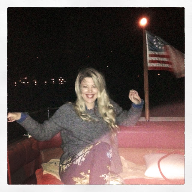 me at the back of the boat at night