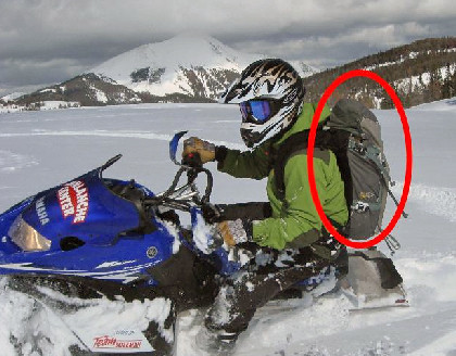Every snowmobile rider in avalanche country needs to carry rescue gear on their back, not on the machine. They should also know how to use the gear. (U.S. Forest Service National Avalanche Center)