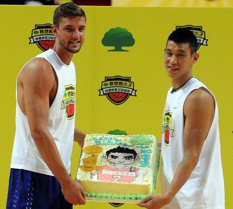 August 23rd, 2013 - Jeremy Lin and Chandler Parson hold Jeremy's 25th birthday cake at a basketball camp in Taiwan