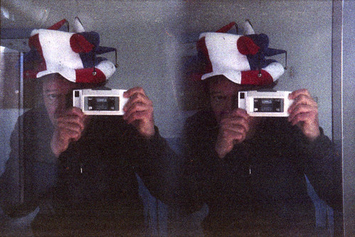 reflected self-portrait with Loreo Stereo camera and jester's hat by pho-Tony