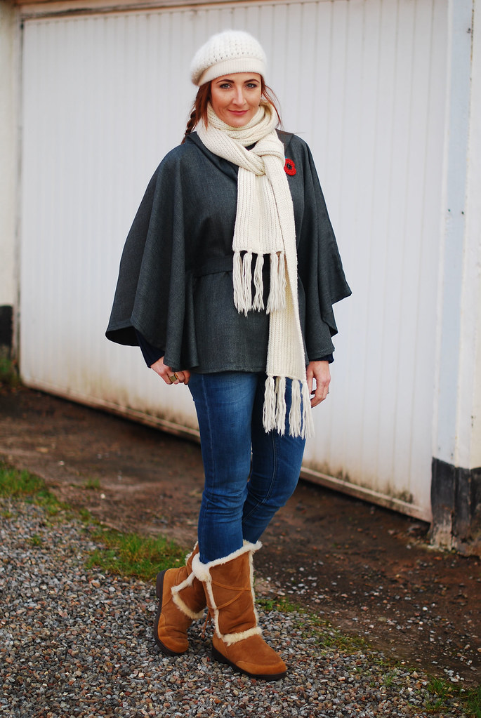Cream beanie and scarf with grey cape, blue skinnies & tan sheepskin boots
