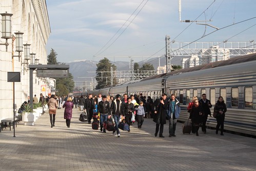 Hoards of passengers board a northbound train from Sochi