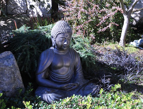 Statue of Buddha in meditation position, garden, Seattle, Washington, USA by Wonderlane