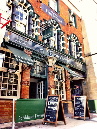 The outside of St Aldate's Tavern with sandwich boards advertising offers