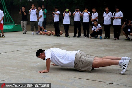 June 30th, 2013 - Yao Ming does push-ups after his team loses a bet on which team could make the most layups.