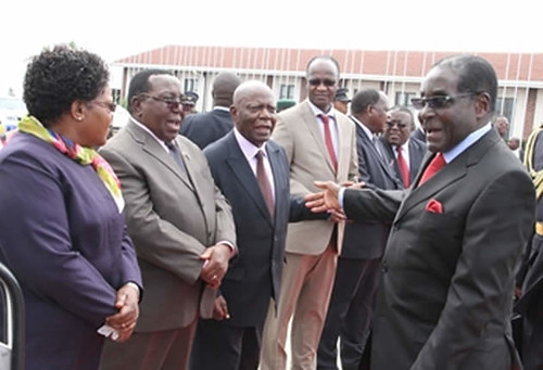 Republic of Zimbabwe President Robert Mugabe with Vice-President Joice Mujuru. He was leaving for a summit in South Africa. by Pan-African News Wire File Photos