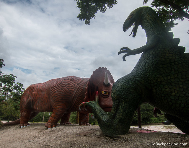 A Triceratops attacks a Godzilla-looking T-Rex